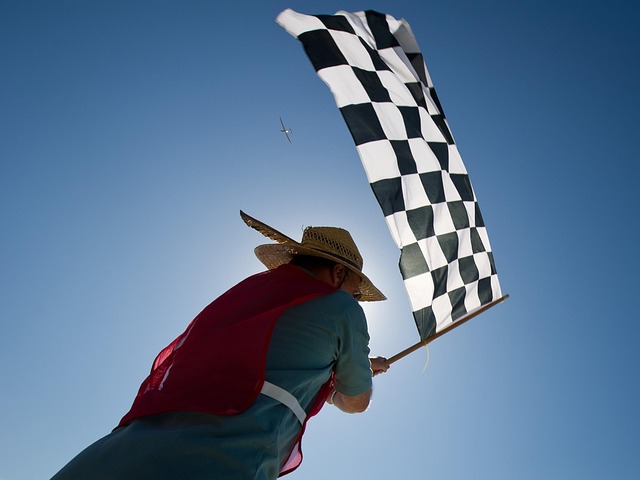 Chequered flag being waved.