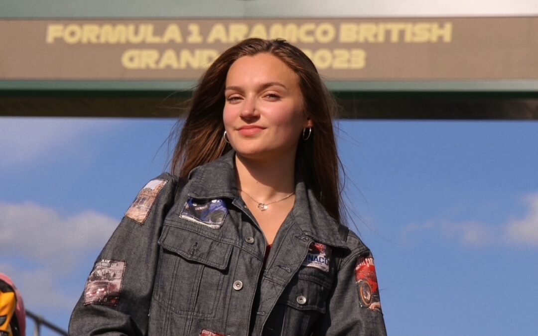 TikToker Skye standing on an F1 grid at the British Grand Prix.